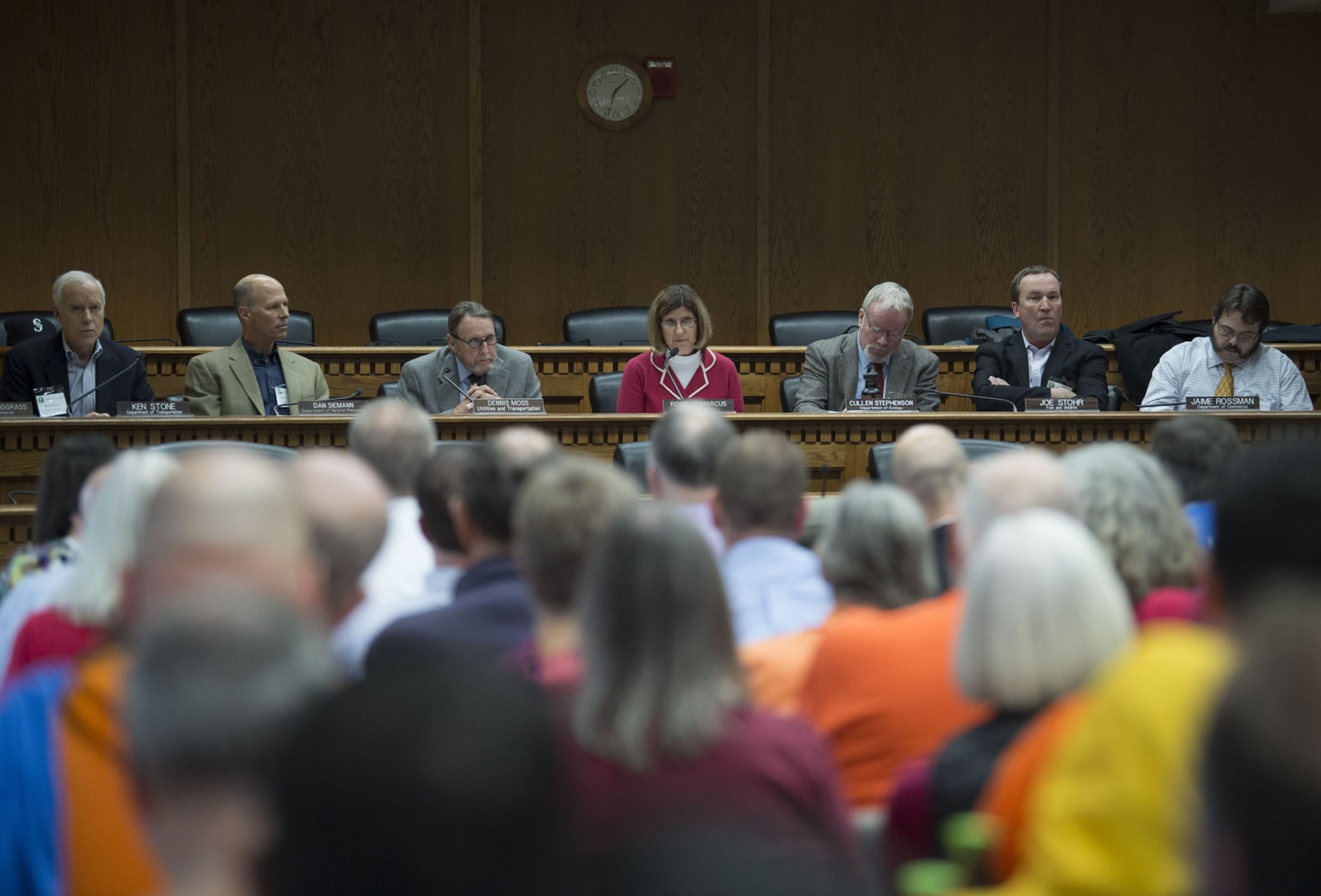 EFSEC chair Roselyn Marcus, center in pink, leads the meeting about the Port of Vancouver oil terminal at the John A. Cherberg Building in Olympia on Tuesday afternoon, Nov. 28, 2017.