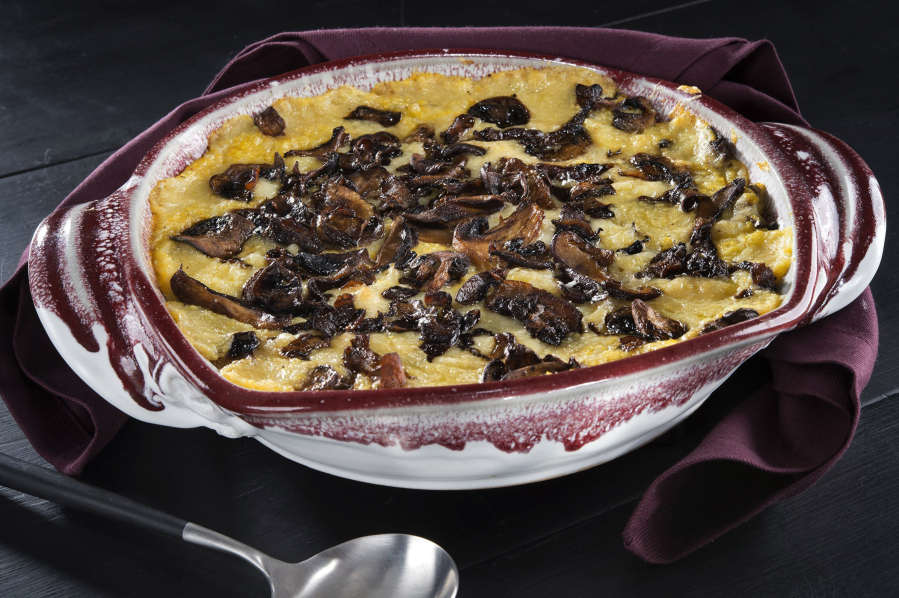 Rustic cheese baked polenta with wild mushrooms.