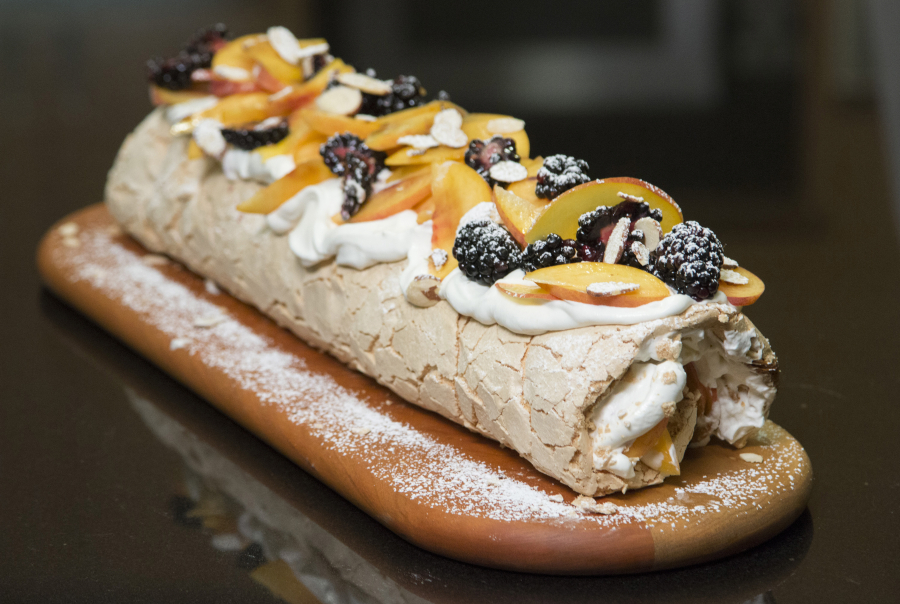 The super popular Brit-Israeli chef comes to the test kitchen with his recipe developer to make a fruit Pavlova (meringue and cream dessert) from their new cookbook. (Myung J.