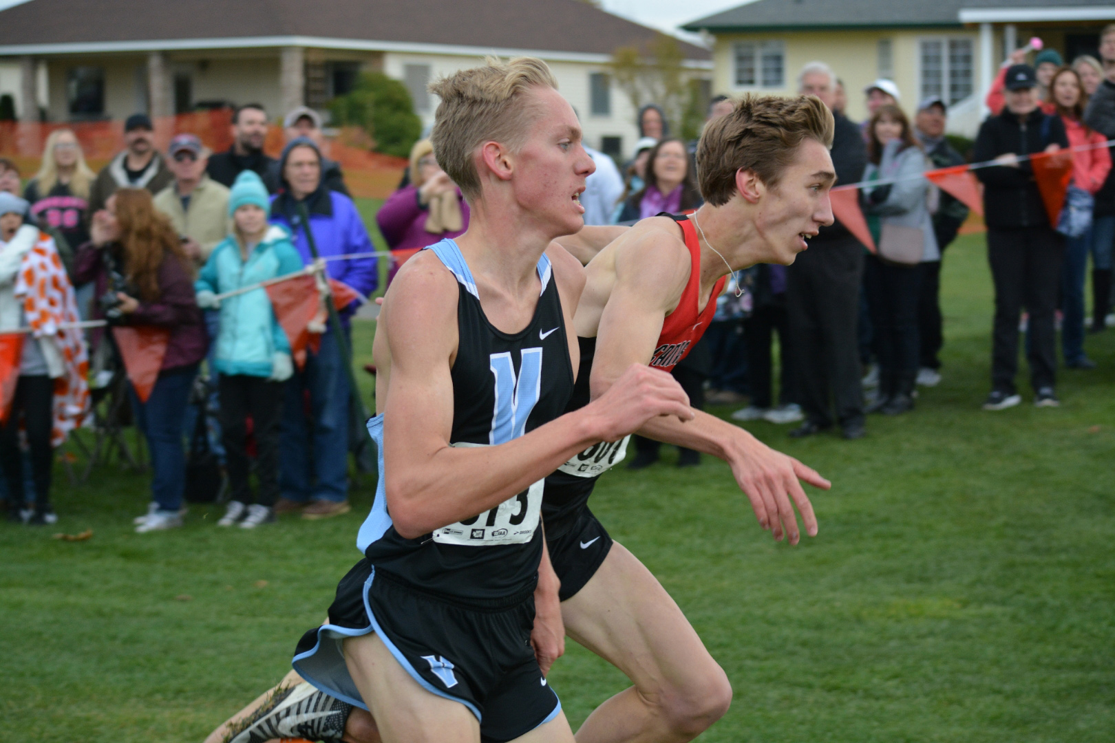 Daniel Maton of Camas, right, and Ryan Kline of Central Valley in Spokane, fight to the finish line. Maton tumbled and Kline captured the 4A boys state cross country championship in 15 minutes, 11 seconds on Saturday, Nov. 5, 2017, at Pasco.