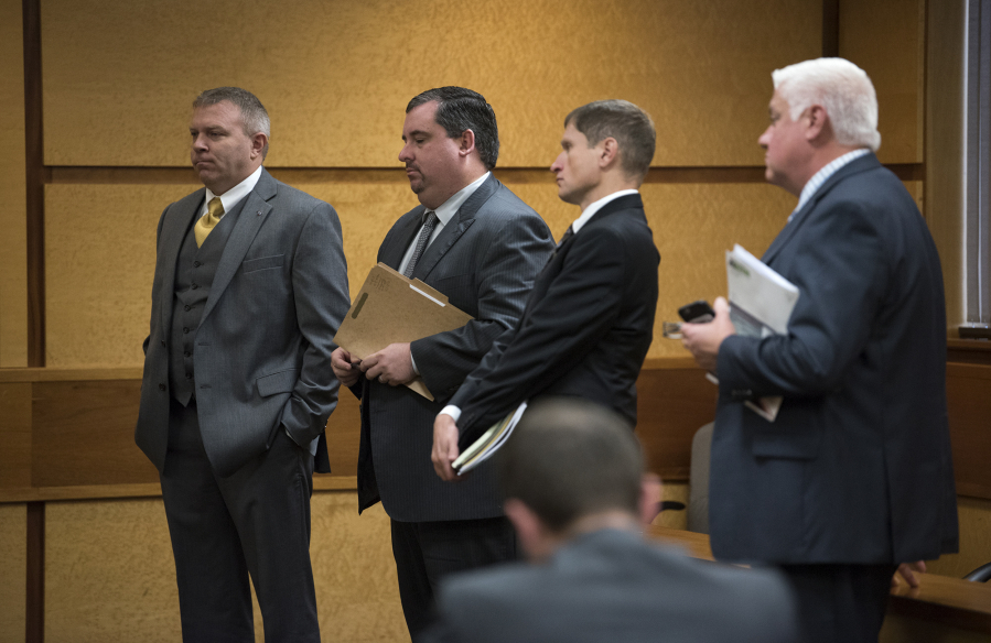 Robert Sabo, left, Sabo’s attorney Erin McAleer, Kris Greene’s attorney Lawrence Merrifield and Port of Vancouver commissioner candidate Kris Greene during an earlier hearing before Clark County District Court Commissioner Todd George on Oct. 18.