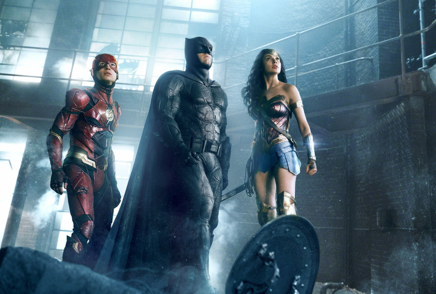 Ezra Miller as the Flash, left, Ben Affleck as Batman and Gal Gadot as Wonder Woman in “Justice League.” Warner Bros.