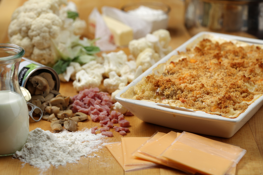 The cauliflower casserole, dubbed Company Casserole on the original recipe card from grandma, called for Old English cheese slices and canned mushrooms. (E.
