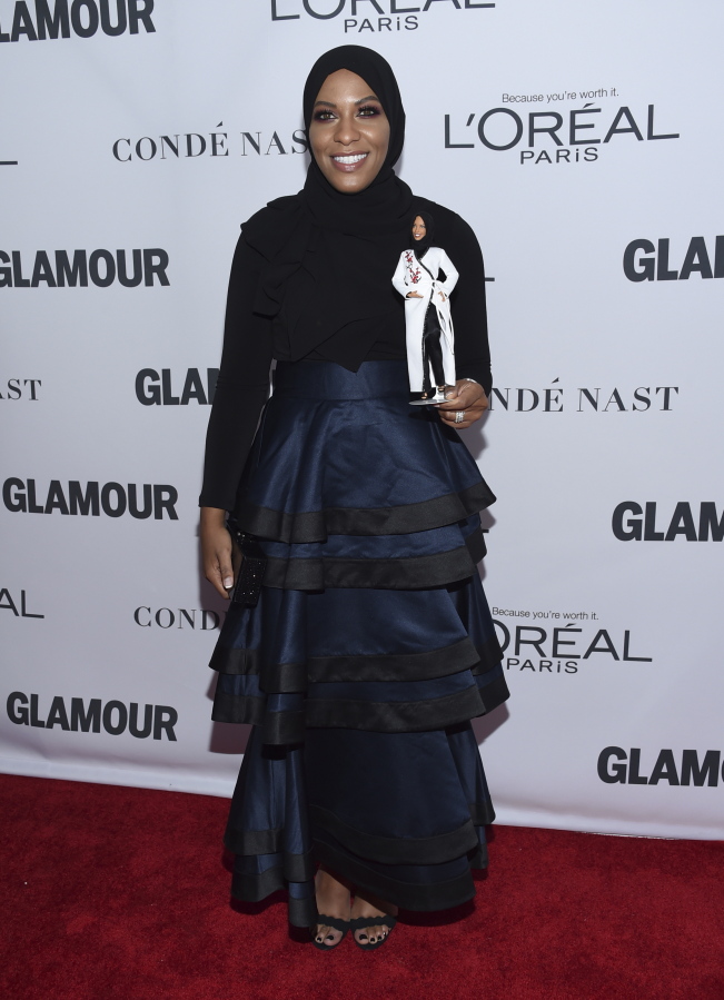 Ibtihaj Muhammad holds a Barbie doll in her likeness at the 2017 Glamour Women of the Year Awards at Kings Theatre on Monday in New York.