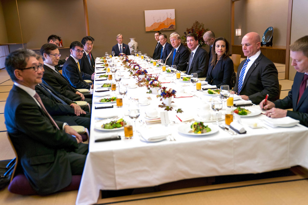 U.S. President Donald Trump, fifth from right, and Japanese Prime Minister Shinzo Abe, fifth from left, sit at a table during a luncheon at Akasaka Palace in Tokyo Monday, Nov. 6, 2017.