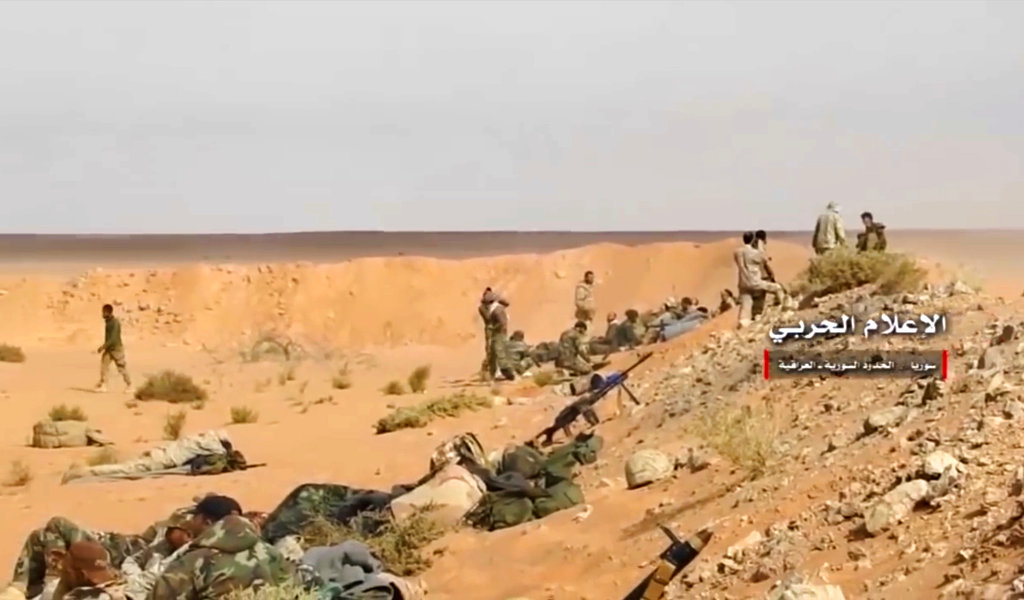 This frame grab from video provided Wednesday, Nov 8, 2017 by the government-controlled Syrian Central Military Media, shows pro-government troops taking up positions on the Iraq-Syria border. The Britain-based Syrian Observatory for Human Rights, said that Islamic State militants have withdrawn from their last stronghold following a government offensive and that government forces and allied troops, including Iraqi fighters are combing Boukamal, a strategic town on the border with Iraq, Thursday.