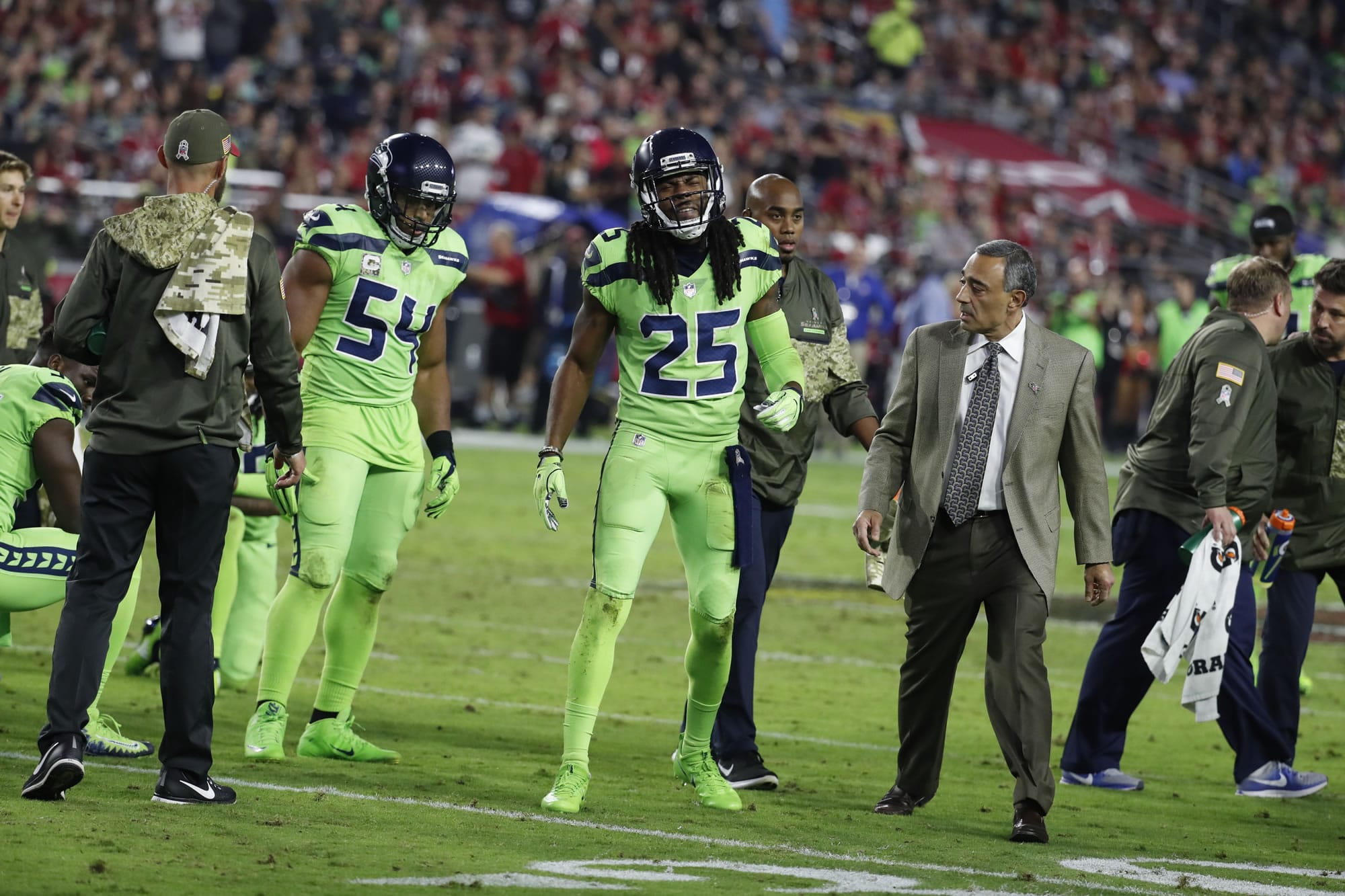 Seattle Seahawks cornerback Richard Sherman (25) leaves the game after an injury during the second half of an NFL football game, Thursday, Nov. 9, 2017, in Glendale, Ariz. Sherman did not return to the game after the injury.
