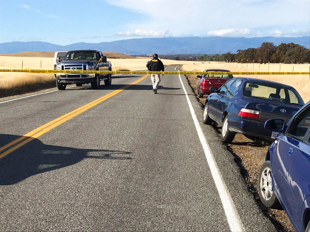 Crime tape blocks off Rancho Tehama Road leading into the Rancho Tehama subdivision south of Red Bluff, Calif., following a fatal shooting on Tuesday, Nov. 14, 2017.