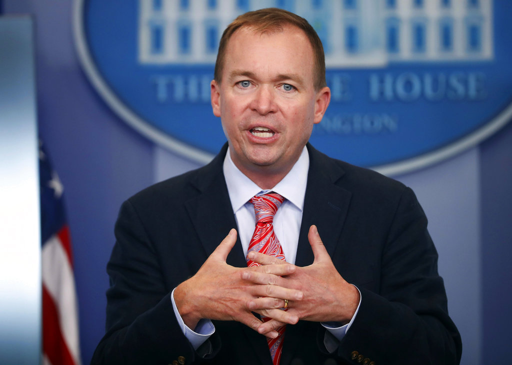 FILE - In this Thursday, July 20, 2017, file photo, Budget Director Mick Mulvaney gestures as he speaks during the daily press briefing at the White House in Washington. Mulvaney and Treasury Secretary Steven Mnuchin sent mixed signals Sunday, Nov. 19, on the fate of a health care provision in the Senate version of a $1.5 trillion measure to overhaul business and personal income taxes that is expected to be voted on after Thanksgiving. "I don't think anybody doubts where the White House is on repealing and replacing Obamacare. We absolutely want to do it," Mulvaney said.