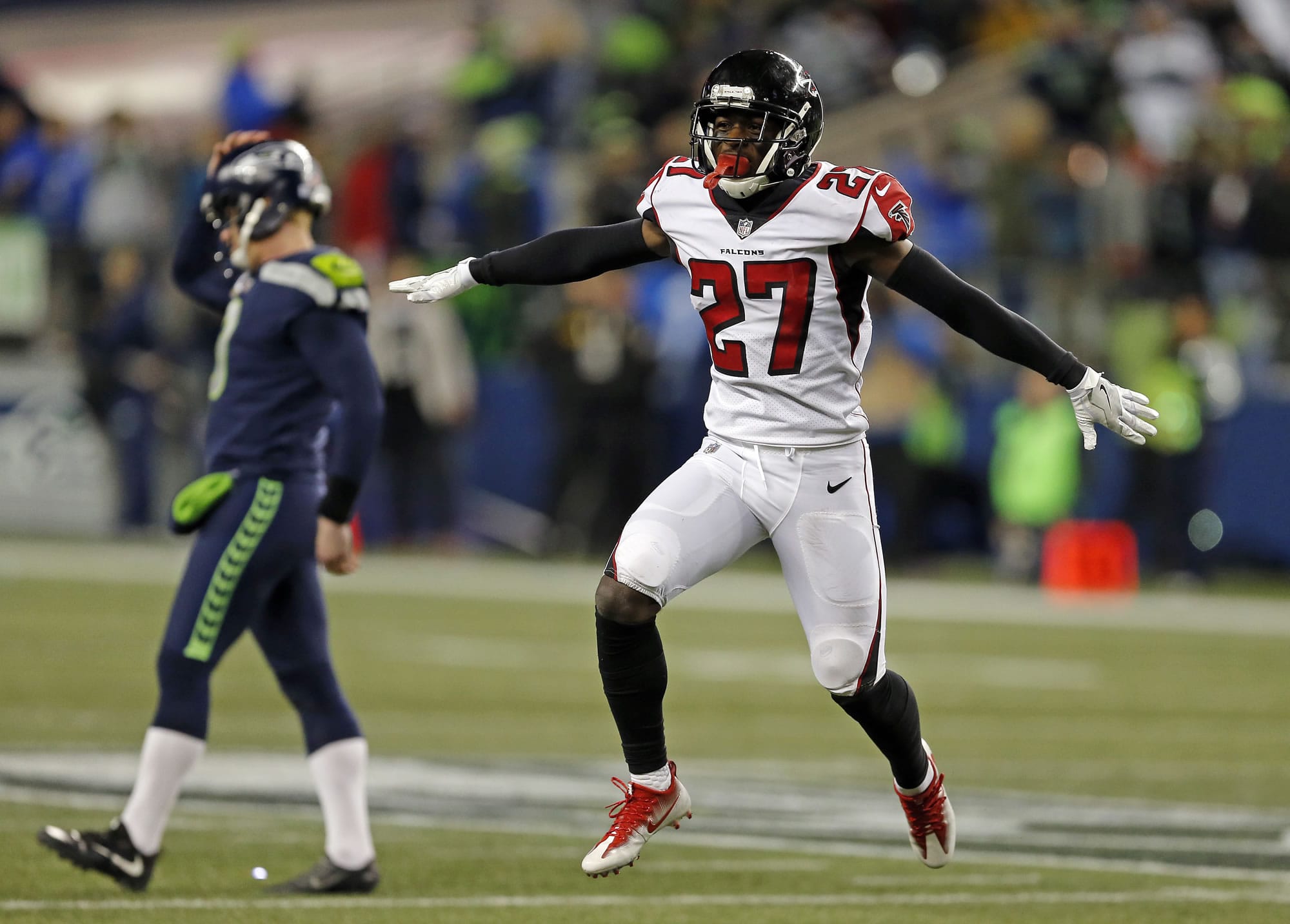 Atlanta Falcons' Damontae Kazee (27) reacts to a missed field goal as Seattle Seahawks holder Jon Ryan walks away at the end of the second half of an NFL football game, Monday, Nov. 20, 2017, in Seattle. The Falcons won 34-31.