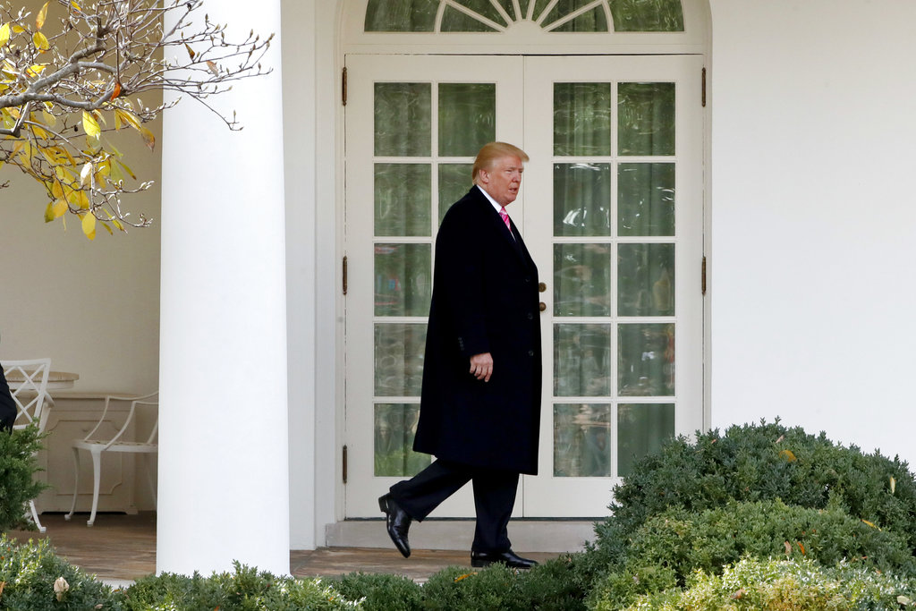 President Donald Trum walks from the Oval Office to the Rose Garden to attend the annual turkey pardoning ceremony Tuesday, Nov. 21, 2017, at the White House in Washington.