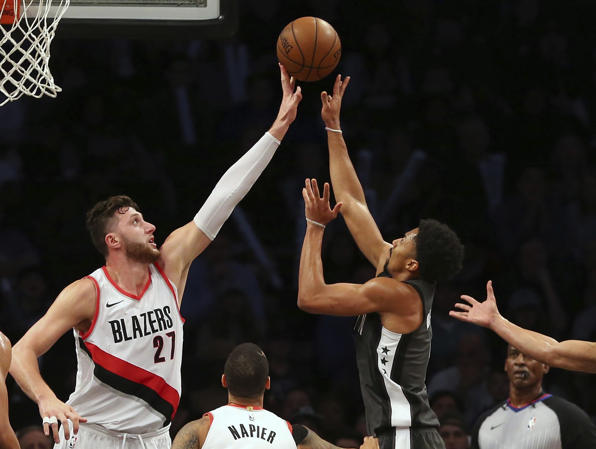 Portland Trail Blazers center Jusuf Nurkic (27) blocks a shot by Brooklyn Nets guard Spencer Dinwiddie, right, during the third quarter of an NBA basketball game in New York, Friday, Nov. 24, 2017. The Trail Blazers defeated the Nets 127-125.