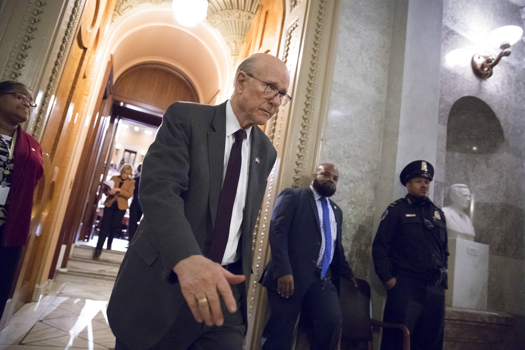 Sen. Pat Roberts, R-Kan., a member of the tax-writing Senate Finance Committee, leaves the Senate floor during votes on Capitol Hill in Washington, Monday evening, Nov. 27, 2017. President Donald Trump and Senate Republicans are scrambling to change a Republican tax bill in an effort to win over holdout GOP senators and pass a tax package by the end of the year. (AP Photo/J.