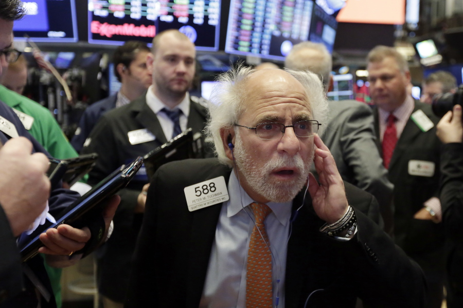 Trader Peter Tuchman works on the floor of the New York Stock Exchange on Thursday.