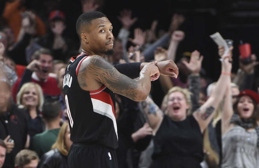 Portland Trail Blazers guard Damian Lillard reacts after hitting a shot in the final seconds of an NBA basketball game against the Los Angeles Lakers in Portland, Ore., Thursday, Nov. 2, 2017. The Blazers won 113-110.