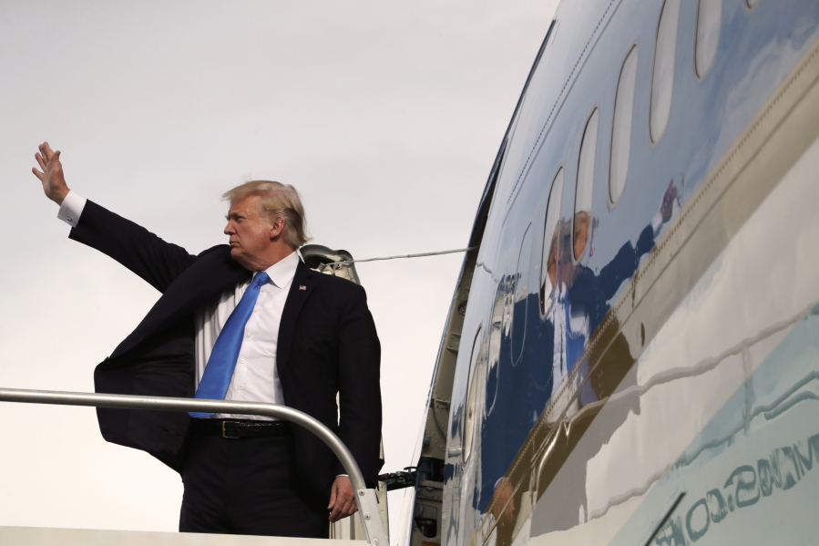 U.S. President Donald Trump waves goodbye as he enters Air Force One after participating in the East Asia Summit on Tuesday in Manila, Philippines. Trump finished a five country trip through Asia visiting Japan, South Korea, China, Vietnam and the Philippines.