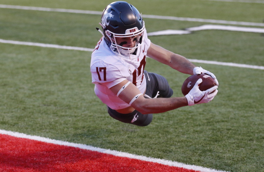 Washington State wide receiver Kyle Sweet (17) dives for a touchdown against Utah in the first half of an NCAA college football game, Saturday, Nov. 11, 2017, in Salt Lake City.