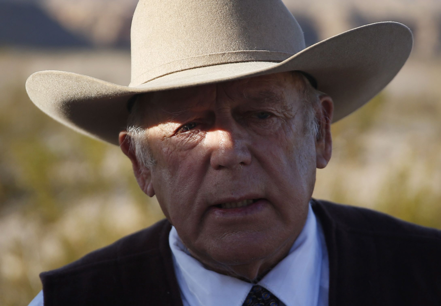 Rancher Cliven Bundy speaks to media Jan. 27, 2016, while standing along the road near his ranch in Bunkerville, Nev.