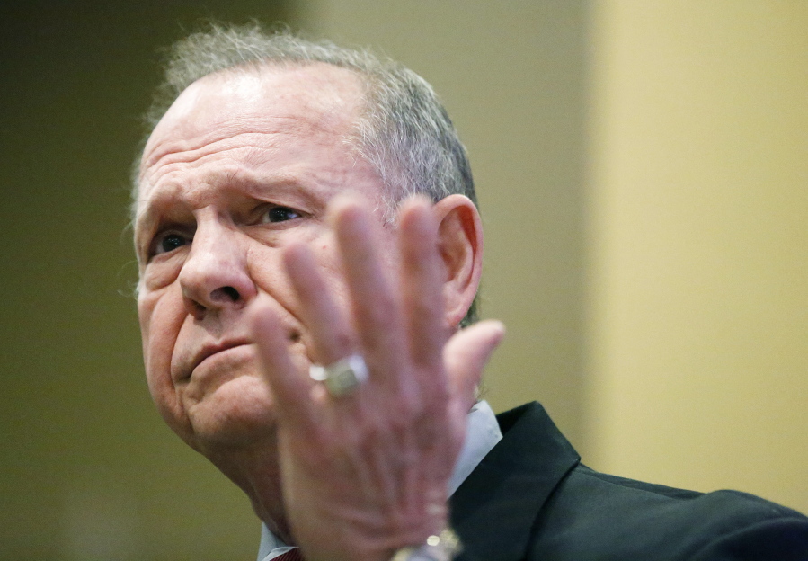 Former Alabama Chief Justice and U.S. Senate candidate Roy Moore speaks at the Vestavia Hills Public library, Saturday in Birmingham, Ala. According to a Thursday Washington Post story an Alabama woman said Moore made inappropriate advances and had sexual contact with her when she was 14. Moore has denied the allegations.