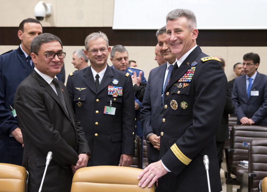 Afghanistan’s acting defense minister Major General Tariq Shah Bahrami, second left, poses for a photo with the US top commander in Afghanistan US Army General John Nicholson, right, during a round table of NATO defense ministers and Resolute Support operational partner nations at NATO headquarters in Brussels on Thursday, Nov. 9, 2017.