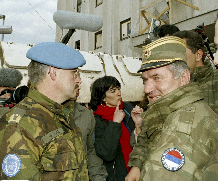 Former Bosnian Serb commander Ratko Mladic, right, leaves the UN headquarters at Sarajevo airport in 1994 after talks with the UN General, Sir Michael Rose and Bosnian Commander Rasim Delic. Ratko Mladic will learn his fate on Nov. 22, 2017, when U.N. judges deliver verdicts in his genocide and war crimes trial.