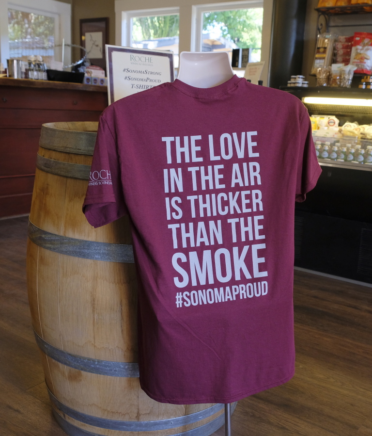 A T-shirt referencing the recent wildfires is for sale in the tasting room at Roche Winery and Vineyards in Sonoma, Calif.