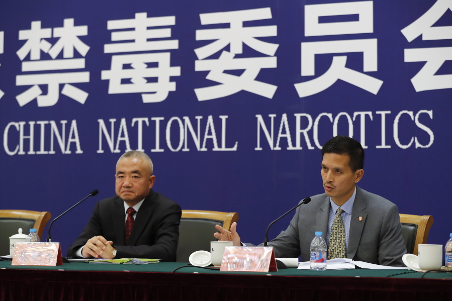 U.S. Drug Enforcement Administration’s representative in Beijing, Lance Ho, right, speaks next to Wei Xiaojun, deputy director-general of the Narcotics Control Bureau of the Ministry of Public Security during a press conference at a hotel in Beijing, on Friday. Wei disputed President Donald Trump’s claim that the opioid flooding the U.S. is mostly produced in China.