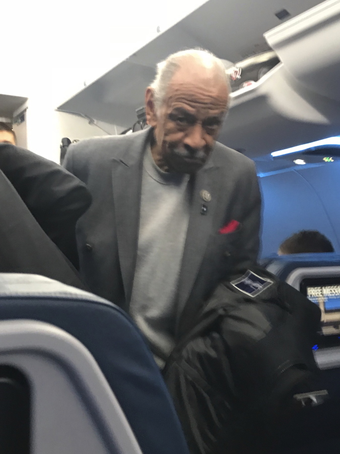 Democratic Rep. John Conyers, the longest serving member of the House, is seen on a plane to Detroit on Tuesday, Nov. 28, 2017. Conyers missed two roll call votes in the House Tuesday night and was photographed by a passenger boarding a Delta Airlines flight to Detroit. Conyers is accused of sexual misconduct by a former staffer.