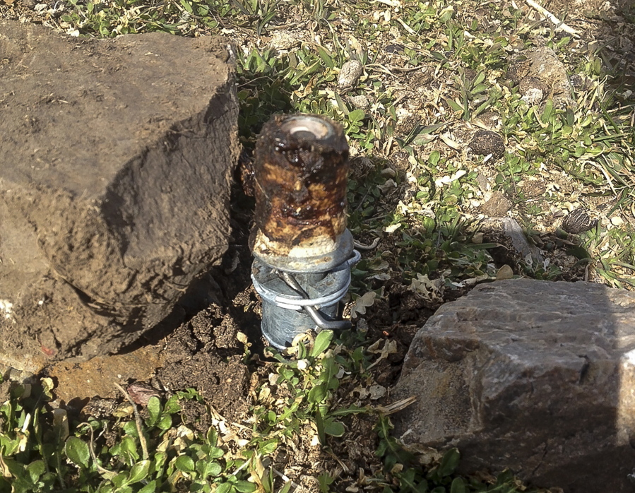 An M-44 cyanide device is seen in Pocatello, Idaho. U.S. officials have reached a tentative deal with wildlife advocates trying to stop the use of predator-killing, poisoned traps known as “cyanide bombs” that injured an Idaho teenager and killed his dog.