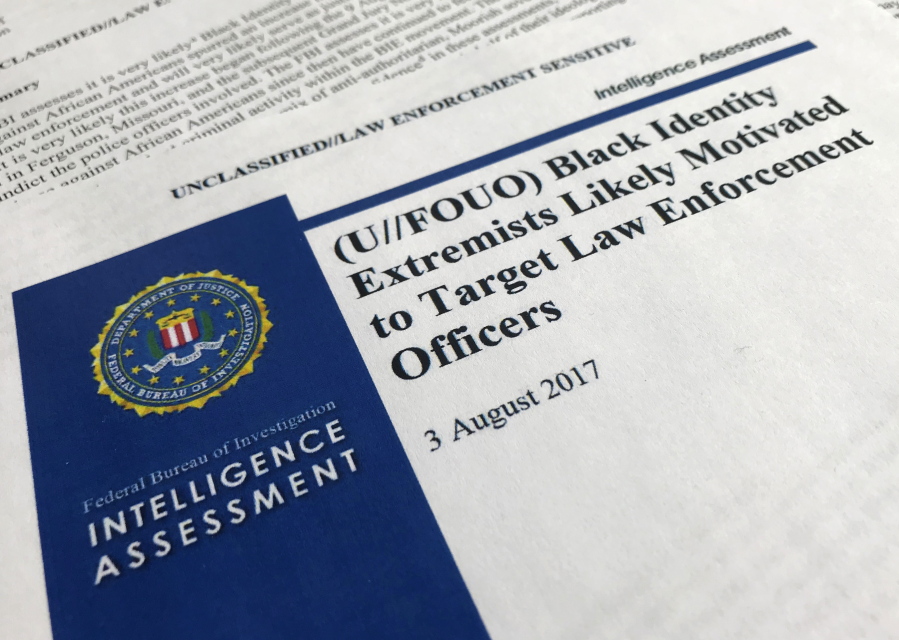 The cover page of an FBI report on “black identity extremists” is seen Friday in Washington.