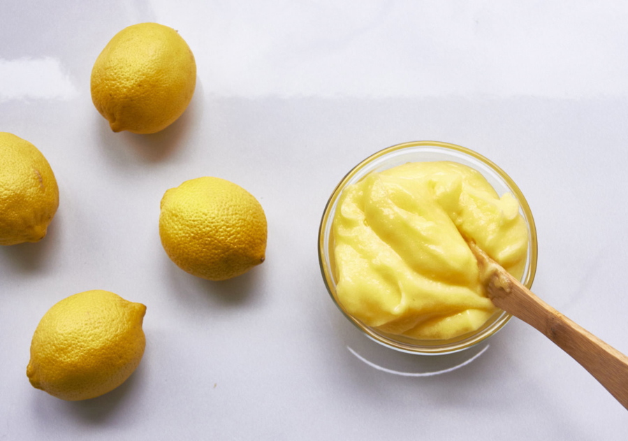 Lemon curd is made with lemon juice, eggs, sugar and butter. The first three ingredients get blended and softly warmed so that the eggs thicken the mixture. Whisking in cold butter finishes it off and smoothes it out.
