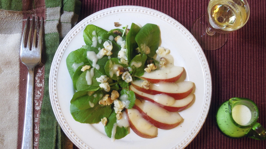 A green salad with pear dressing, Gorgonzola cheese and toasted walnuts (Sara Moulton via AP)
