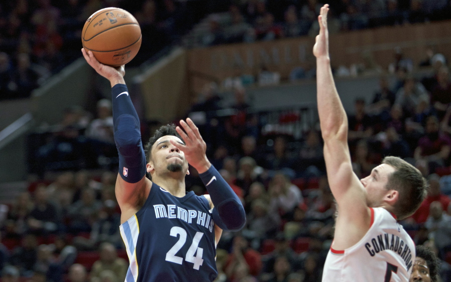 Memphis Grizzlies forward Dillon Brooks, left, shoots over Portland Trail Blazers guard Pat Connaughton, right, during the first half of an NBA basketball game in Portland, Ore., Tuesday, Nov. 7, 2017.