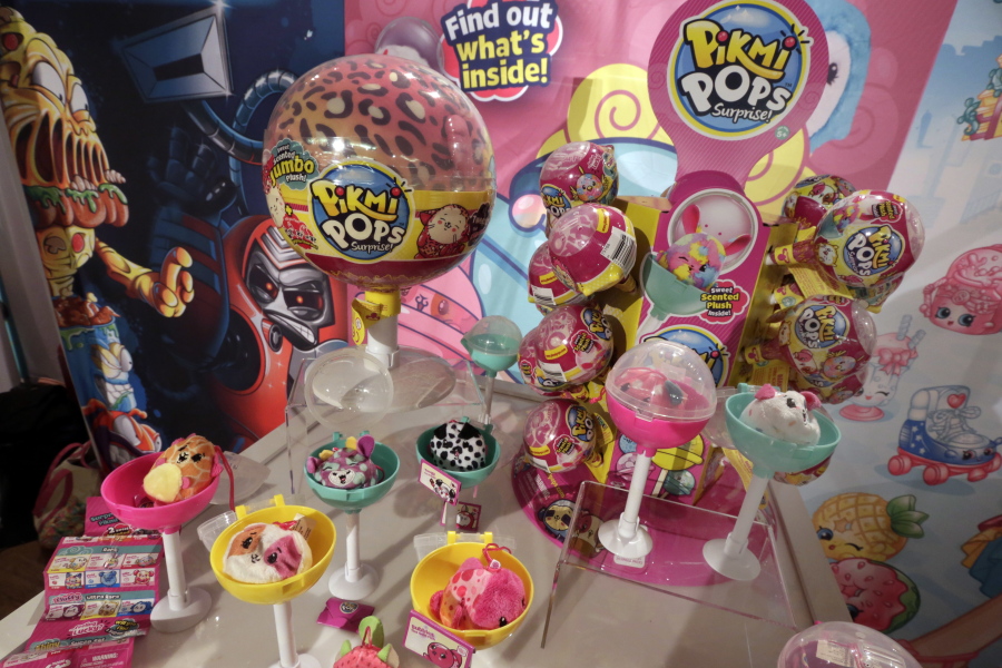 This Tuesday, Sept. 26, 2017, photo shows Pikmi Pops from Moose Toys on display at the 2017 TTPM Holiday Showcase in New York. Some of the hottest toys this year are LOL Surprise and Pikmi Pops. These and similar toys hide small stuffed animals or dolls inside plastic balls that are wrapped in several layers of packaging. Kids peel each layer, revealing tiny bags filled with trinkets, stickers, messages or other doll accessories as they go.