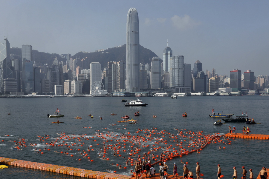 Competitors swim during the annual 1-kilometer harbor race Oct. 29 at the Victoria Harbour in Hong Kong. In a report published Tuesday, market research firm Euromonitor International said it estimates 25.7 million arrivals in Hong Kong this year.