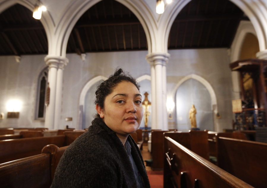 Amanda Morales, 33, poses for a photograph in the sanctuary of the Holyrood Episcopal Church, the Bronx borough of New York. Morales has been living in two small rooms of the gothic church at the northern edge of Manhattan since August, shortly after immigration authorities ordered her deported to her homeland of Guatemala.