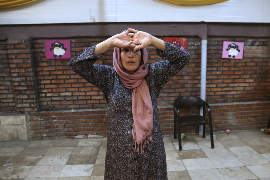 Mahboobeh Zeinali, who is HIV-positive, attends an acting class at Reviving Values aid group institute in Tehran, Iran. “Everybody has a very bad attitude toward this disease,” she says.