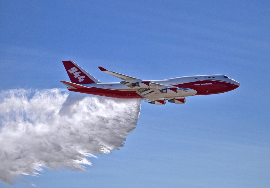 A Boeing 747 makes a demonstration water drop in May 2016. The giant passenger jet converted to fight wildfires but grounded by U.S. officials for much of this year’s fire season could be aloft much more next year.