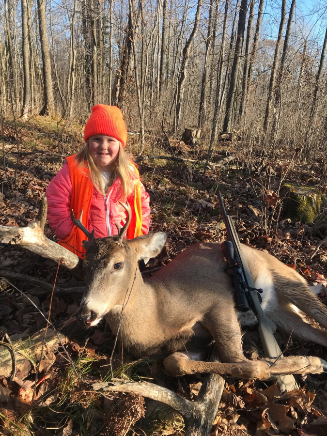 Lexie Harris, 6, poses after bagging a buck Nov. 19 in Taylor County, Wis. Lexie is among the first youngsters to legally shoot a buck after the state eliminated the minimum hunting age.