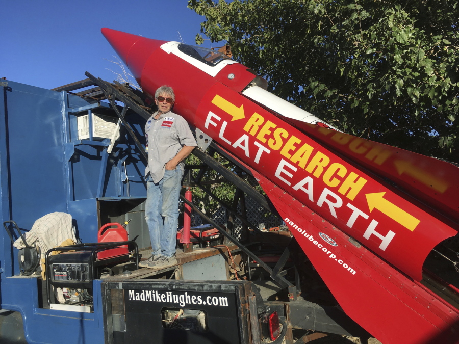 Daredevil/limousine driver Mad Mike Hughes is shown with with his steam=powered rocket constructed out of salvage parts on a five-acre property that he leases in Apple Valley, Cal. Hughes plans to launch his homemade contraption on Saturday near the ghost town of Amboy, Cal., at a speed of roughly 500 miles-per-hour.