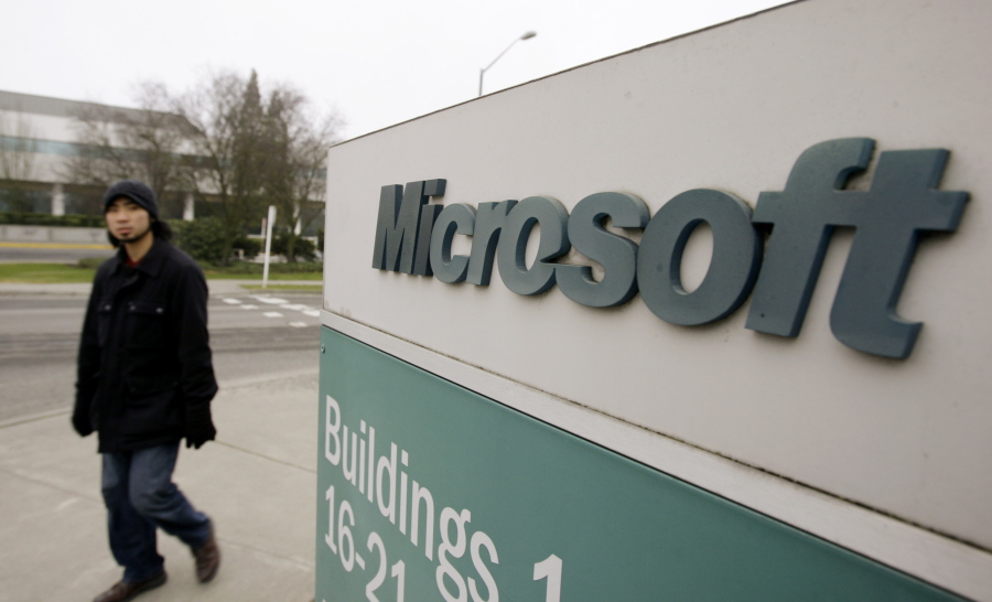 A man walks on the Microsoft headquarters campus in Redmond. Microsoft says it’s overhauling its longtime headquarters with an 18-building construction project that will make room for another 8,000 workers. The announcement came ahead of the company’s annual shareholders meeting Wednesday, Nov. 29, 2017.
