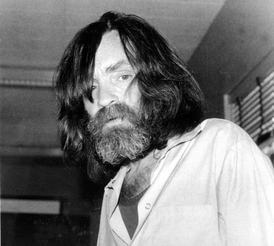 In this June 10, 1981 file photo, convicted murderer Charles Manson is photographed during an interview with television talk show host Tom Snyder in a medical facility in Vacaville, Calif. Authorities say Manson, cult leader and mastermind behind 1969 deaths of actress Sharon Tate and several others, died on Sunday. He was 83.