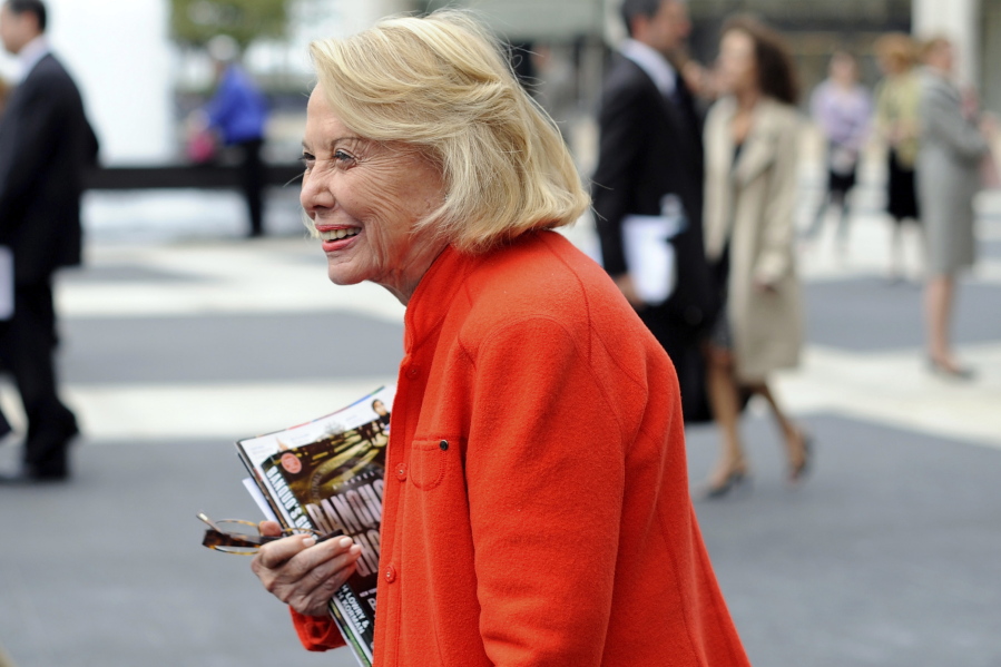 In this Aug. 9, 2009, file photo, Liz Smith leaves the Celebration of Life Memorial ceremony for Walter Cronkite at Avery Fisher Hall in New York. Smith, a gossip columnist whose mixture of banter, barbs, and bon mots about the glitterati helped her climb the A-list as high as many of the celebrities she covered, has died. Literary agent Joni Evans told The Associated Press she died in New York on Sunday. She was 94.