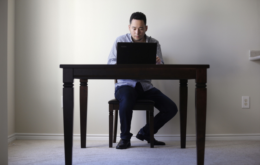 Freelancer Jaimyn Chang works in the solitude of his home office in Raleigh, N.C.