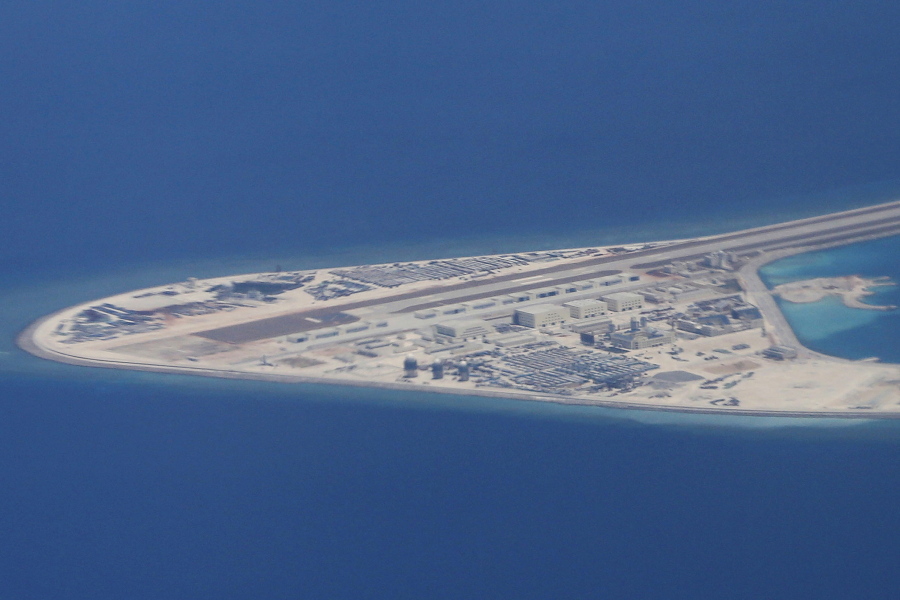 An airstrip, structures and buildings on China’s man-made Subi Reef in the Spratly chain of islands in the South China Sea are seen from a Philippine Air Force C-130 transport plane of the Philippine Air Force. Leaders of Southeast Asian countries and China have agreed to launch talks on a “code of conduct” aimed at controlling disputes in the South China Sea, a step they described as a milestone, but which some experts said was unlikely to bring concrete results. China has also reportedly halted work on land reclamation for a new airport in the southern resort city of Sanya and is gearing up to launch a new submersible to explore for resources in the South China Sea.