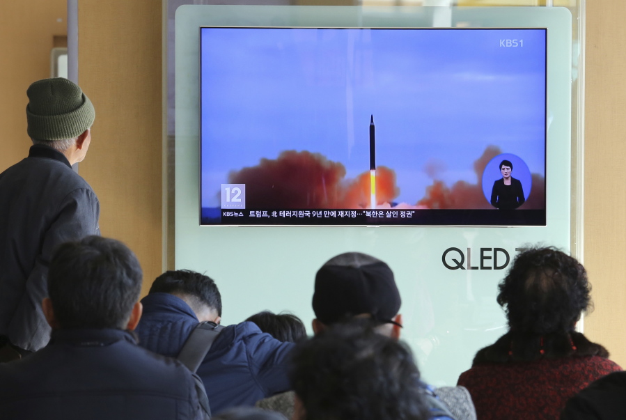 People watch a TV screen showing file footage of North Korea’s missile launch at Seoul Railway Station in Seoul, South Korea, on Tuesday. U.S. President Donald Trump announced Monday the U.S. is putting North Korea’s “murderous regime” on America’s terrorism blacklist, despite questions about Pyongyang’s support for international attacks beyond the assassination of its leader’s half brother in February.