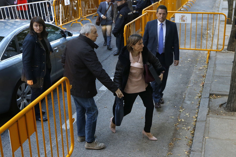 Ex-speaker of the Catalonia parliament Carme Forcadell , front right, arrives at the Spain’s Supreme Court in Madrid on Thursday. Six Catalan lawmakers are testifying Thursday before a Spanish judge over claims that they ignored Constitutional Court orders and allowed an independence vote in Catalonia’s regional parliament.