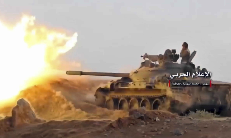 This frame grab from video provided Wednesday, Nov 8, 2017, by the government-controlled Syrian Central Military Media, shows a tank firing on militants’ positions on the Iraq-Syria border. The United States and Russia are nearing an agreement on Syria for how they hope to resolve the Arab country’s civil war once the Islamic State group is defeated, officials said Nov. 9.