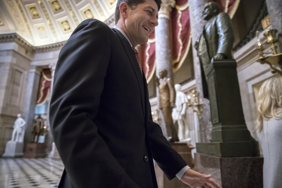 House Speaker Paul Ryan, R-Wis., walks through Statuary Hall to his office on Capitol Hill in Washington, Friday. Ryan introduced a far-reaching tax overhaul Thursday that will be a priority for the GOP. (AP Photo/J.
