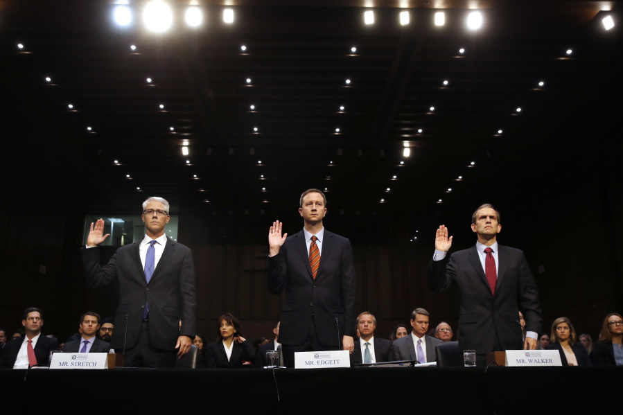 From left, Facebook’s General Counsel Colin Stretch, Twitter’s Acting General Counsel Sean Edgett, and Google’s Senior Vice President and General Counsel Kent Walker, are sworn in for a Senate Intelligence Committee hearing on Russian election activity and technology Wednesday on Capitol Hill in Washington.